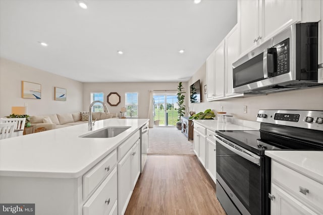 346 Goodwick Dr, Middletown, DE 19709 - kitchen featuring stainless steel appliances, light wood-type flooring, recessed lighting, light countertops, and white cabinetry