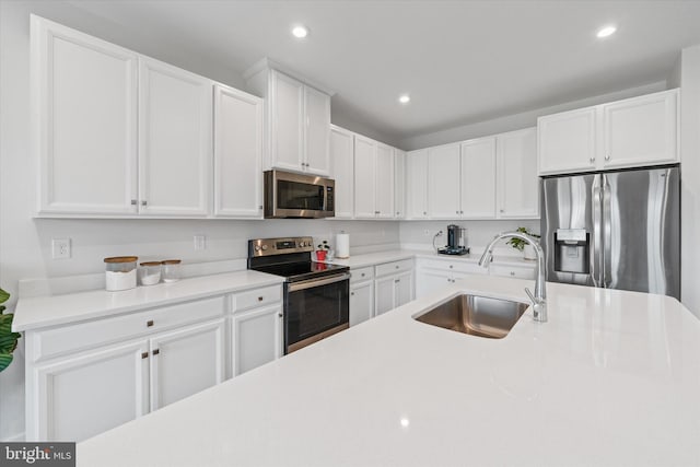 346 Goodwick Dr, Middletown, DE 19709 - kitchen featuring stainless steel appliances, recessed lighting, white cabinets, and light countertops