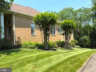 5361 Trevino Dr, Haymarket, VA 20169 - view of property exterior with a yard