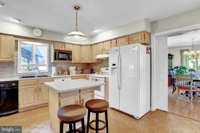 1319 Shady Ln, Tamaqua, PA 18252 - kitchen with white appliances, light brown cabinets, light countertops, backsplash, and under cabinet range hood
