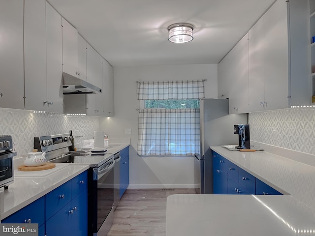12987 Holly Way, Lusby, MD 20657 - kitchen featuring stainless steel electric range, under cabinet range hood, blue cabinets, light wood-type flooring, and backsplash