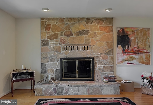 12987 Holly Way, Lusby, MD 20657 - detailed view of a stone fireplace and wood finished floors