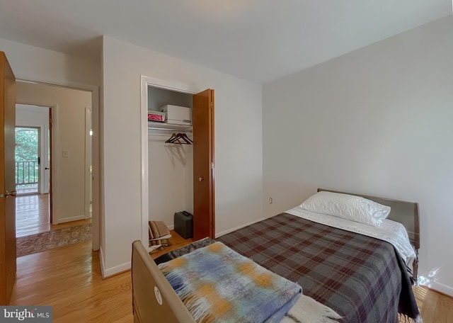 12987 Holly Way, Lusby, MD 20657 - bedroom with light wood finished floors and a closet