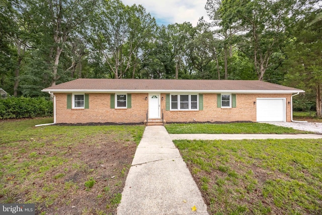 7043 Cromwell Ave, Salisbury, MD 21804 - ranch-style home with a garage, a front yard, brick siding, and view of wooded area