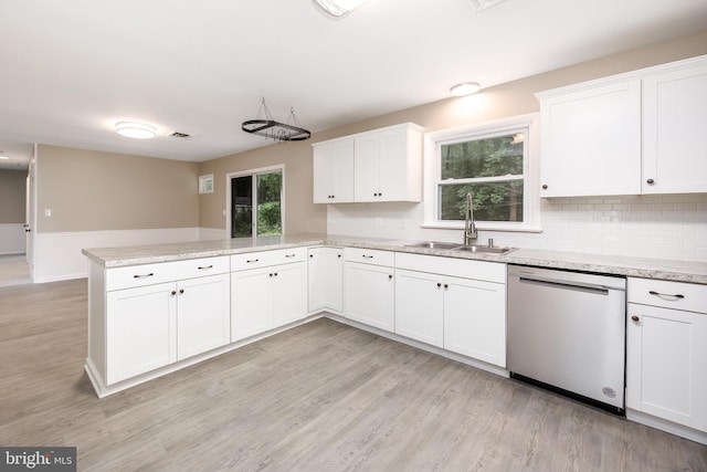 7043 Cromwell Ave, Salisbury, MD 21804 - kitchen with dishwasher, a peninsula, light wood finished floors, white cabinets, and wainscoting