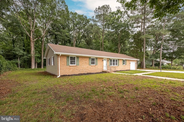 7043 Cromwell Ave, Salisbury, MD 21804 - view of front of property with brick siding, a front lawn, driveway, and a garage