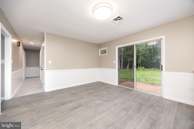 7043 Cromwell Ave, Salisbury, MD 21804 - spare room with a wainscoted wall and wood finished floors
