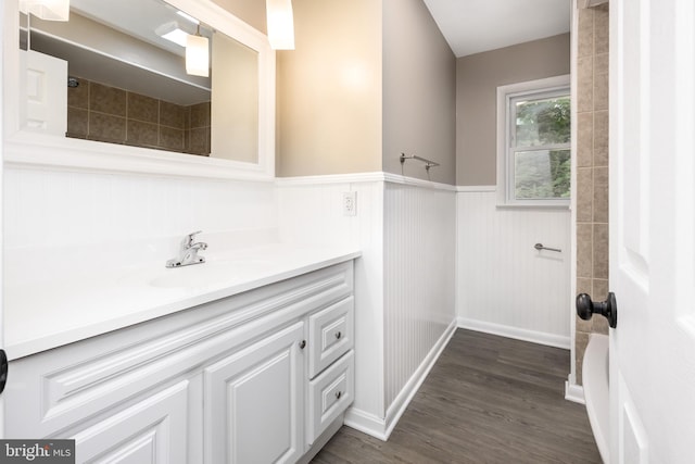 7043 Cromwell Ave, Salisbury, MD 21804 - full bathroom featuring vanity, a wainscoted wall, wood finished floors, and a shower