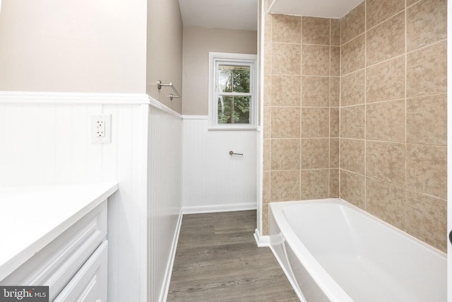 7043 Cromwell Ave, Salisbury, MD 21804 - full bathroom featuring wood finished floors, wainscoting, vanity, and shower / bathtub combination