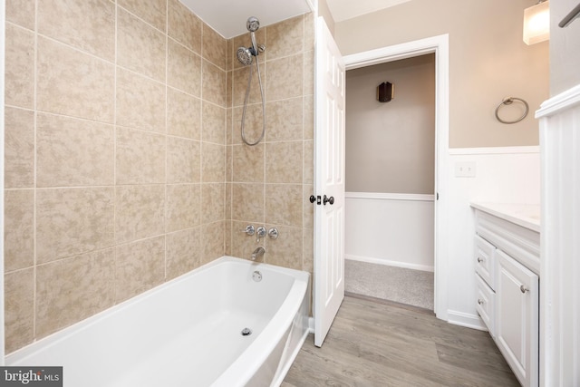 7043 Cromwell Ave, Salisbury, MD 21804 - bathroom featuring vanity, wood finished floors, and shower / washtub combination