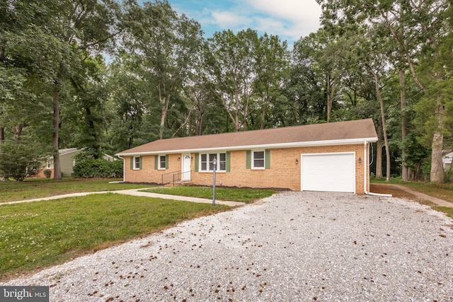 7043 Cromwell Ave, Salisbury, MD 21804 - ranch-style home with a garage, driveway, a front yard, brick siding, and view of wooded area