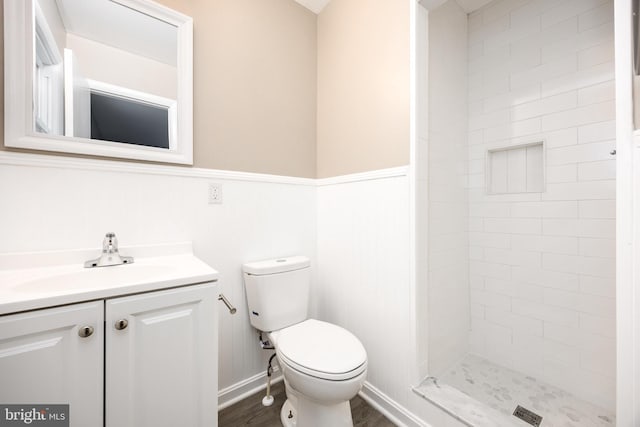 7043 Cromwell Ave, Salisbury, MD 21804 - bathroom with vanity, a stall shower, wood finished floors, and a wainscoted wall