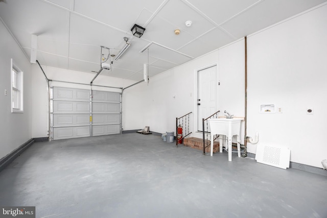 7043 Cromwell Ave, Salisbury, MD 21804 - garage with a sink and a garage door opener