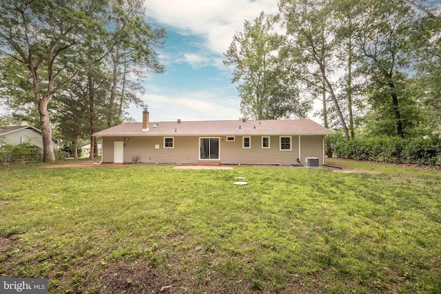 7043 Cromwell Ave, Salisbury, MD 21804 - back of house featuring a chimney, a lawn, and a patio area