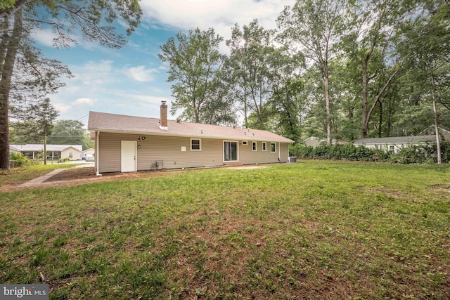 7043 Cromwell Ave, Salisbury, MD 21804 - back of property with a lawn and a chimney