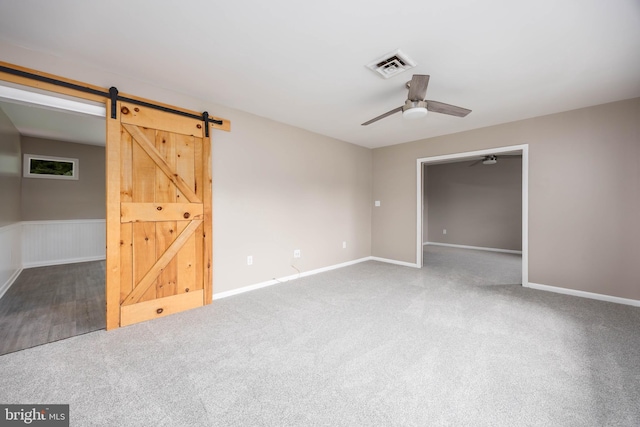 7043 Cromwell Ave, Salisbury, MD 21804 - carpeted empty room featuring ceiling fan and a barn door
