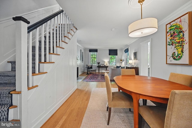 1646 Foxhall Rd NW, Washington, DC 20007 - dining space featuring wood finished floors, stairway, and crown molding
