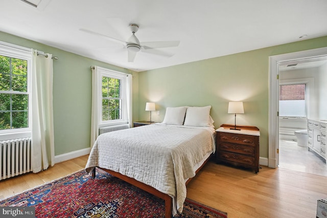 1646 Foxhall Rd NW, Washington, DC 20007 - bedroom with radiator heating unit, light wood finished floors, and ceiling fan