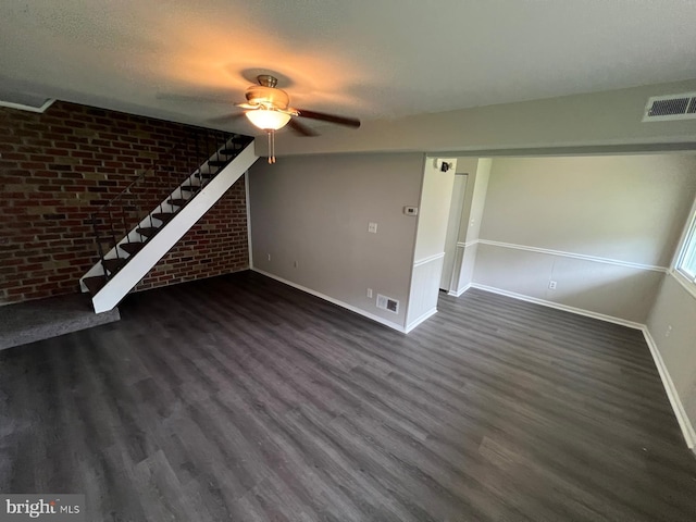 1730 Fountain Rock Way Unit 1730-C, Edgewood, MD 21040 - unfurnished living room with ceiling fan, dark wood-style flooring, brick wall, and a textured ceiling