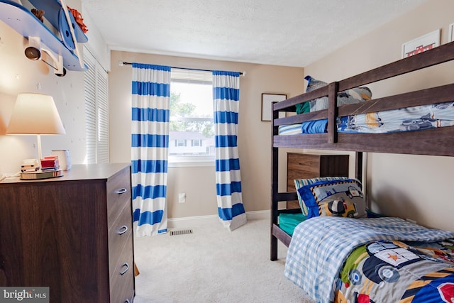 4328 Rolling Stone Way, Alexandria, VA 22306 - carpeted bedroom with a textured ceiling and baseboards