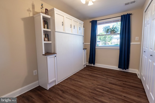 4328 Rolling Stone Way, Alexandria, VA 22306 - unfurnished bedroom with dark wood finished floors and baseboards