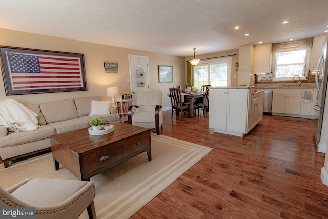 4328 Rolling Stone Way, Alexandria, VA 22306 - living room with light wood-style floors, recessed lighting, and a textured ceiling