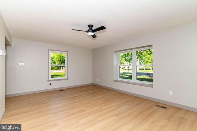 43 Vernon Ct, Sicklerville, NJ 08081 - empty room with healthy amount of natural light, light wood-type flooring, and ceiling fan