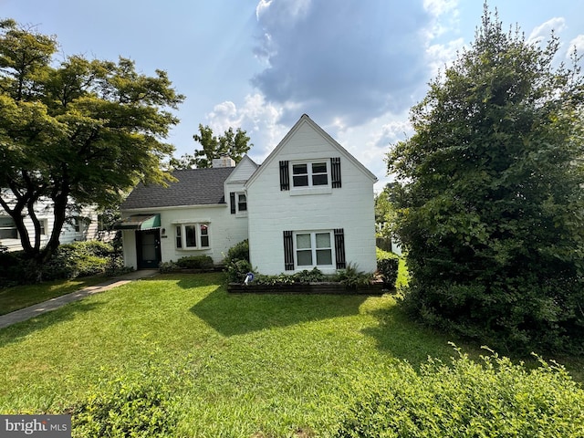 6517 Lehnert St, Baltimore, MD 21207 - traditional-style home with a front lawn and a chimney