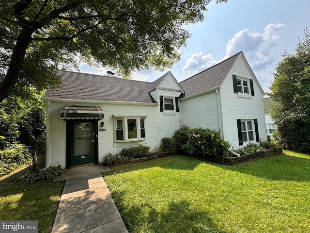 6517 Lehnert St, Baltimore, MD 21207 - view of front of home with a front yard and roof with shingles
