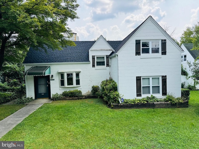 6517 Lehnert St, Baltimore, MD 21207 - view of front of home featuring a front lawn, roof with shingles, and a chimney