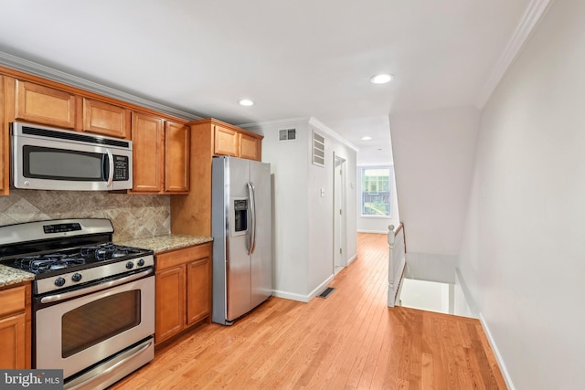 434 N Budd St, Philadelphia, PA 19104 - kitchen with stainless steel appliances, crown molding, light wood-style flooring, decorative backsplash, and recessed lighting