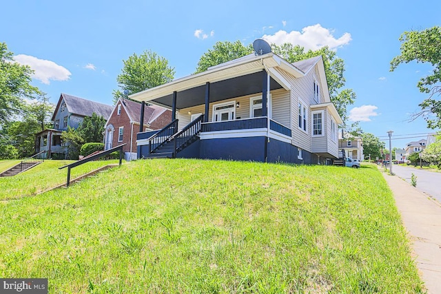 4001 Ridgecroft Rd, Baltimore, MD 21206 - view of front facade featuring a front yard, covered porch, and stairs