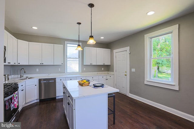 4001 Ridgecroft Rd, Baltimore, MD 21206 - kitchen with stainless steel dishwasher, gas range oven, plenty of natural light, a kitchen bar, and recessed lighting