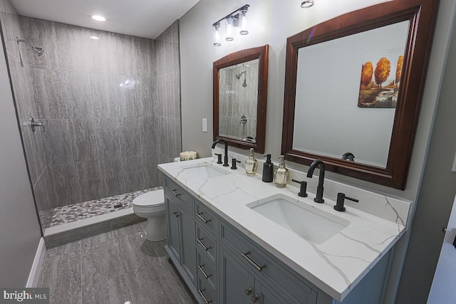 4001 Ridgecroft Rd, Baltimore, MD 21206 - bathroom with double vanity, a tile shower, and recessed lighting