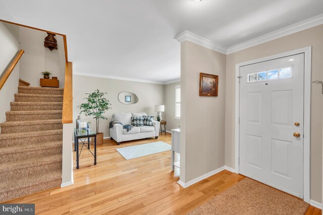 1632 Breakers Dr, Manahawkin, NJ 08050 - entrance foyer with stairs, light wood-type flooring, and ornamental molding