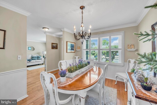 1632 Breakers Dr, Manahawkin, NJ 08050 - dining space with a chandelier, ornamental molding, and light wood-style floors
