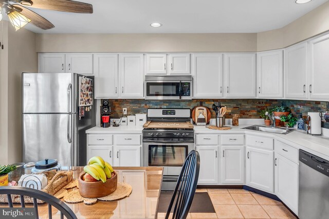 1632 Breakers Dr, Manahawkin, NJ 08050 - kitchen featuring stainless steel appliances, white cabinetry, tasteful backsplash, and recessed lighting
