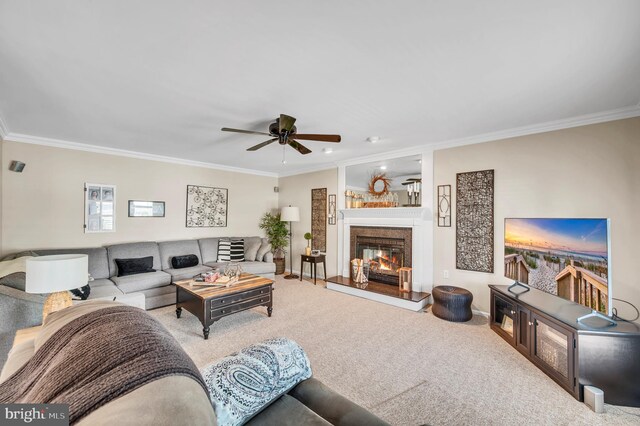 1632 Breakers Dr, Manahawkin, NJ 08050 - living area with crown molding, carpet, a glass covered fireplace, and a ceiling fan