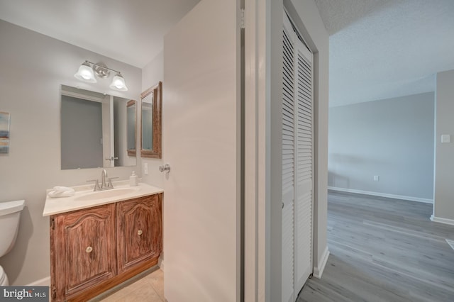 5300 Holmes Run Pkwy Unit 709, Alexandria, VA 22304 - bathroom featuring vanity, a closet, and wood finished floors
