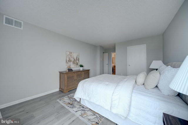 5300 Holmes Run Pkwy Unit 709, Alexandria, VA 22304 - bedroom featuring wood finished floors and baseboards