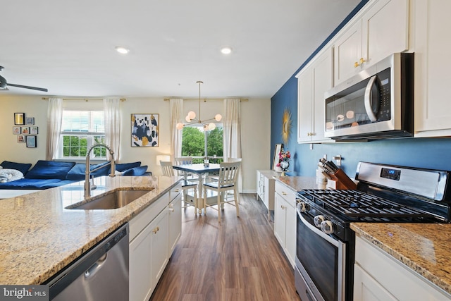 2014 Fauna Dr, Frederick, MD 21702 - kitchen featuring stainless steel appliances, dark wood-type flooring, open floor plan, white cabinets, and recessed lighting