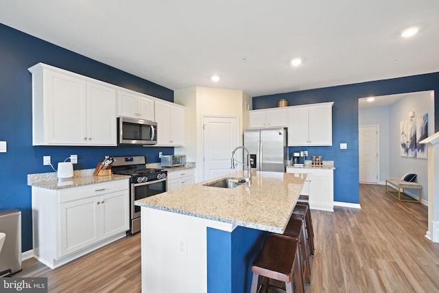 2014 Fauna Dr, Frederick, MD 21702 - kitchen with appliances with stainless steel finishes, light wood finished floors, white cabinetry, and recessed lighting