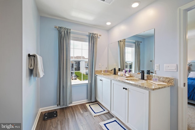 2014 Fauna Dr, Frederick, MD 21702 - ensuite bathroom with wood finished floors, double vanity, and recessed lighting