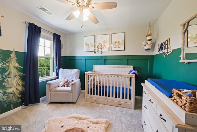 2014 Fauna Dr, Frederick, MD 21702 - carpeted bedroom featuring a wainscoted wall, a nursery area, and a ceiling fan
