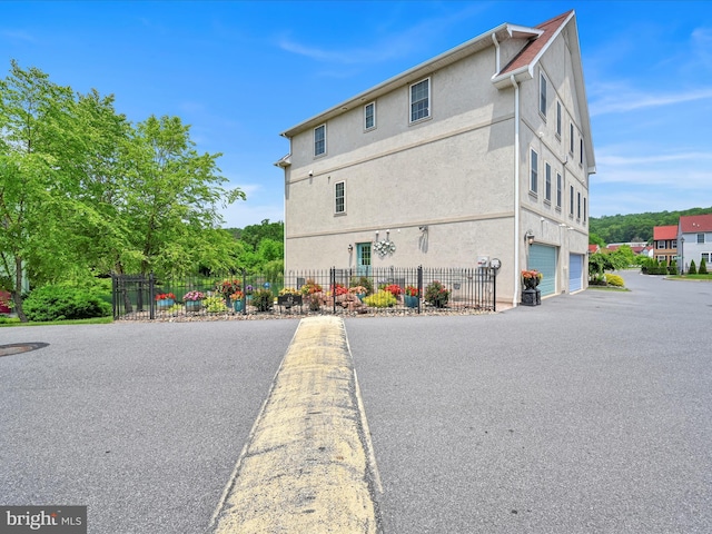 42 Bissenden Way, Reinholds, PA 17569 - view of property exterior with an attached garage and stucco siding