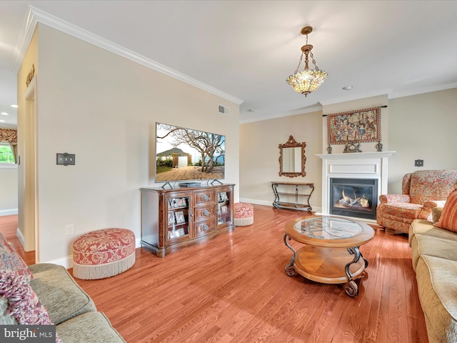 42 Bissenden Way, Reinholds, PA 17569 - living room with ornamental molding, wood finished floors, and a glass covered fireplace
