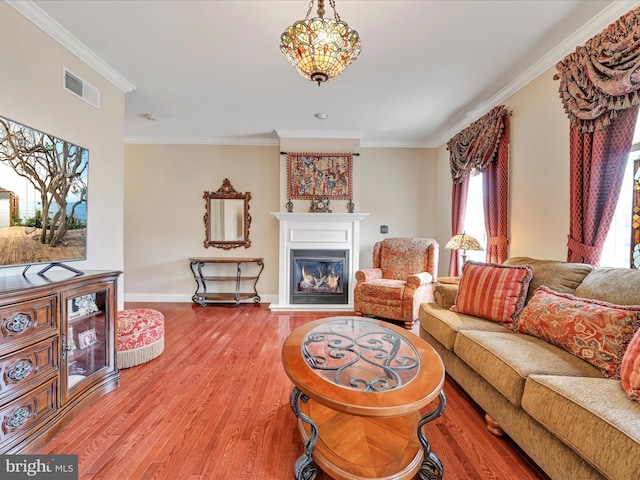 42 Bissenden Way, Reinholds, PA 17569 - living area with wood finished floors, ornamental molding, and a glass covered fireplace
