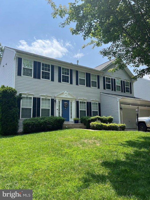 5959 Lyceum Ln, Manassas, VA 20112 - view of front facade featuring a front yard and an attached garage