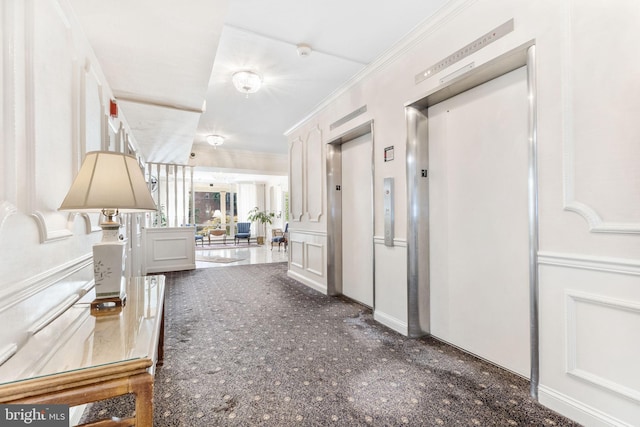 1301 N Harrison St Unit 1106, Wilmington, DE 19806 - corridor with elevator, ornamental molding, carpet, and a decorative wall