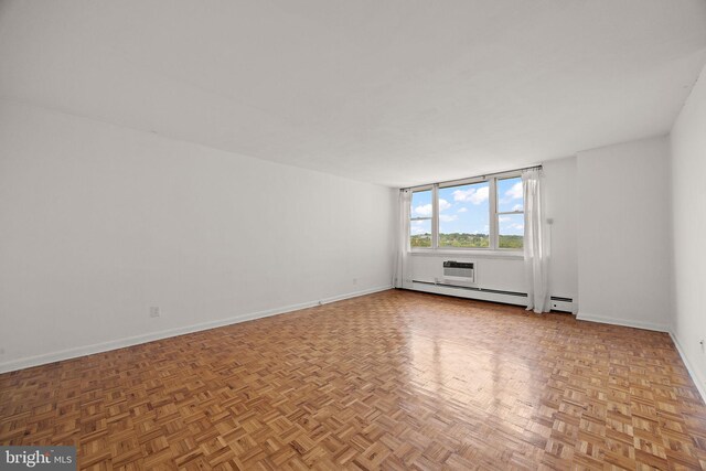 1301 N Harrison St Unit 1106, Wilmington, DE 19806 - spare room featuring baseboard heating and a wall unit AC